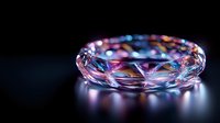 Luminous crystal bracelet with geometric facets reflecting pink and blue light against dark background, creating magical sparkle and ethereal glow. Luxury jewelry concept.