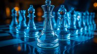 Glass chess pieces illuminated in cool blue light on chessboard, queen piece in focus with pawns and bishops creating dramatic depth perspective. Strategic game concept.