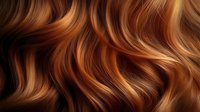 Luxurious wavy hair with rich copper and golden highlights flowing in elegant curves, showcasing natural texture and shine for beauty and haircare concepts.