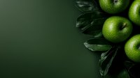 Fresh green apples with water drops and dark leaves arranged on dark green background with copy space for text, top view composition for food design.