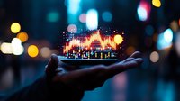 Glowing financial chart hologram floating above open palm against blurred city lights background, representing digital trading and market analysis.