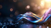 Glowing colorful light waves flow through dark space with bokeh effect background creating dynamic motion and energy visualization for technology designs.