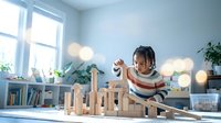 Young African American girl with braids playing with wooden building blocks in bright modern playroom with natural light and plants.