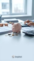 Pink piggy bank with coins on office desk while person calculates finances on calculator with financial documents and charts for budgeting planning.
