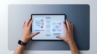 Male hands holding tablet displaying colorful technology icons and digital interface elements for modern business presentations and tech concepts.