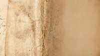 Aged parchment paper texture with torn edges and weathered surface for vintage design projects and historical document backgrounds.