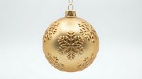 Golden Christmas ornament ball with embossed snowflake patterns hanging on white background, perfect for holiday decorations and festive designs.