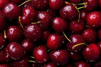 Fresh ripe cherries with water droplets, deep red color and green stems. Perfect for food photography, recipe illustrations, and healthy eating concepts.