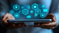 Digital technology icons floating above tablet device held in hands, glowing cyan interface symbols showing communication, data, and connectivity in dark background.