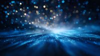 Magical blue light rays bursting through dark background with glowing bokeh particles and sparkles creating dreamy atmospheric effect for fantasy backgrounds.