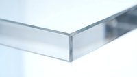 Clear tempered glass panel corner detail showing polished edges and transparency for modern architectural and interior design applications.