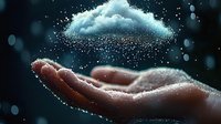 Magical glowing cloud floating above open palm with sparkling particles and bokeh effects against dark background, creating mystical atmospheric scene.