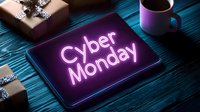 Glowing neon Cyber Monday text on dark tablet screen with wrapped gifts and coffee cup on blue wooden table, holiday shopping concept.