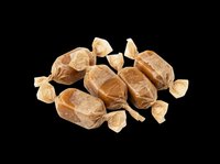 Wrapped caramel candies pile isolated on transparent background, ready for sweet shop designs, stickers, print on demand, sublimation, and clipart use.