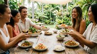 Group of diverse young adults enjoying casual meal together outdoors in garden setting with fresh vegetables and natural light, suitable for lifestyle, wellness, community and dining concepts.