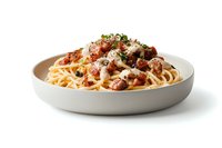 Spaghetti pasta with rich meat sauce and grated parmesan cheese in white round plate on white background, perfect for restaurant menu or cookbook.