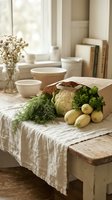 Fresh vegetables in a paper bag on a rustic wooden table with linen cloth, cauliflower, zucchini, dill, parsley, farmhouse kitchen.