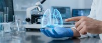 Medical professional in blue gloves holding holographic lung projection in modern laboratory for respiratory health research and pulmonary medicine education.