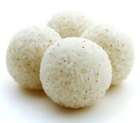 Round white rice balls with black sesame seeds on white background, traditional Asian cuisine onigiri isolated for food photography and menu design.
