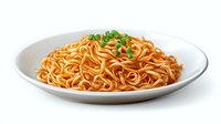 Fresh cooked asian noodles garnished with chopped green onions served on white ceramic plate, appetizing pasta dish with vibrant sauce.
