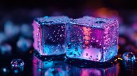 Glowing ice cubes with water drops in neon pink and blue lights against dark background create atmospheric mood for cocktail and beverage photography.