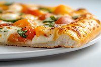 Fresh baked pizza slice with melted cheese, cherry tomatoes and herbs on white plate. Homemade comfort food ready for restaurant menu or cooking blog content.
