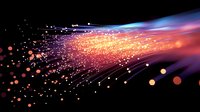 Glowing optical fiber strands with orange and blue light effects against dark background, sparkling particles create dynamic motion blur pattern.