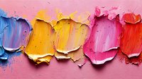 Vibrant oil paint smears in blue, yellow, pink, and red tones with thick textured application showing palette knife technique on pink background.