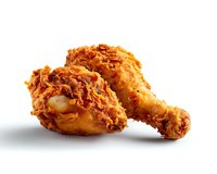 Crispy golden fried chicken legs with crunchy breading and juicy meat on white isolated background, ready for menu, packaging and advertising designs.