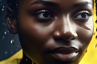 Close up portrait of young African woman with flawless dark skin and natural makeup against yellow background with bokeh light effects, expressing confidence and beauty.