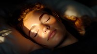 Young woman with red hair sleeping peacefully in warm sunlight, face illuminated by natural golden glow. Serene expression shows tranquility and rest.