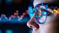 Young Asian woman wearing glasses with reflection of programming code and stock market data charts, glowing blue digital display background for fintech concept.