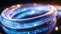 Glowing blue light trail with sparkles and bokeh effects on dark background creates magical circular motion path with luminous particles.