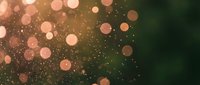 Abstract bokeh background with warm golden and pink light circles creating dreamy atmosphere for festive designs and romantic projects.
