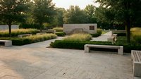 Modern minimalist park with concrete benches and geometric landscaping in golden hour light for urban design projects.
