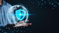 Businessman holding glowing digital shield protecting globe with network connections representing cybersecurity and data protection technology solutions.