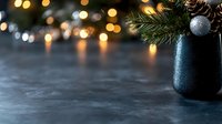 Festive winter composition with glowing bokeh lights and evergreen branches in dark vase against blurred background, copy space for seasonal greeting cards.