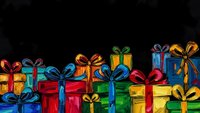 Colorful wrapped gift boxes with ribbons and bows arranged in festive display against dark background for holiday celebrations and special occasions.