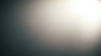 Soft blurred gradient background with warm light tones transitioning from dark to bright, creating atmospheric depth for overlay text and graphics.