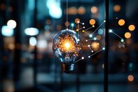 Glowing light bulb with connected dots forming network pattern against blurred bokeh background, symbolizing innovation and creative technology solutions.