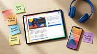 Read on Python, focus on learning programming languages and web development with tablet, smartphone, and headphones on wooden desk for online courses.