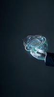 Businessman hand holding futuristic holographic interface with glowing digital elements and data visualization for technology and innovation concepts.