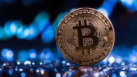 Golden cryptocurrency coin against blurred blue trading chart background showing market volatility and digital finance trends.
