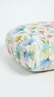 Round floor cushion with watercolor floral pattern featuring multicolored blooms and green stems on white background, suitable for home decor and interior design projects.