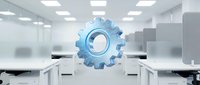 Blue metallic gear mechanism floating in modern white office workspace with desks and ceiling lights for business automation concepts.