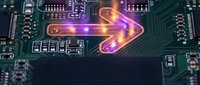 Glowing orange arrow on green circuit board with electronic components and microchips. Technology concept for digital transformation and data processing.