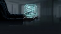 Young male professional holding glowing neon holographic display showing financial analytics and data charts, representing digital technology, business intelligence, and future innovation in corporate environment.