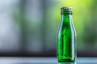 Green glass bottle with water droplets on blurred natural background for beverage packaging and eco-friendly product marketing campaigns.