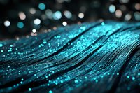 Abstract turquoise feather macro with sparkling water droplets and bokeh lights creating magical texture for luxury design and wellness concepts.