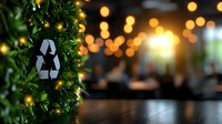 Recycling symbol on green plant decoration against blurred warm bokeh lights and wooden surface, environmental sustainability concept for events and celebrations.